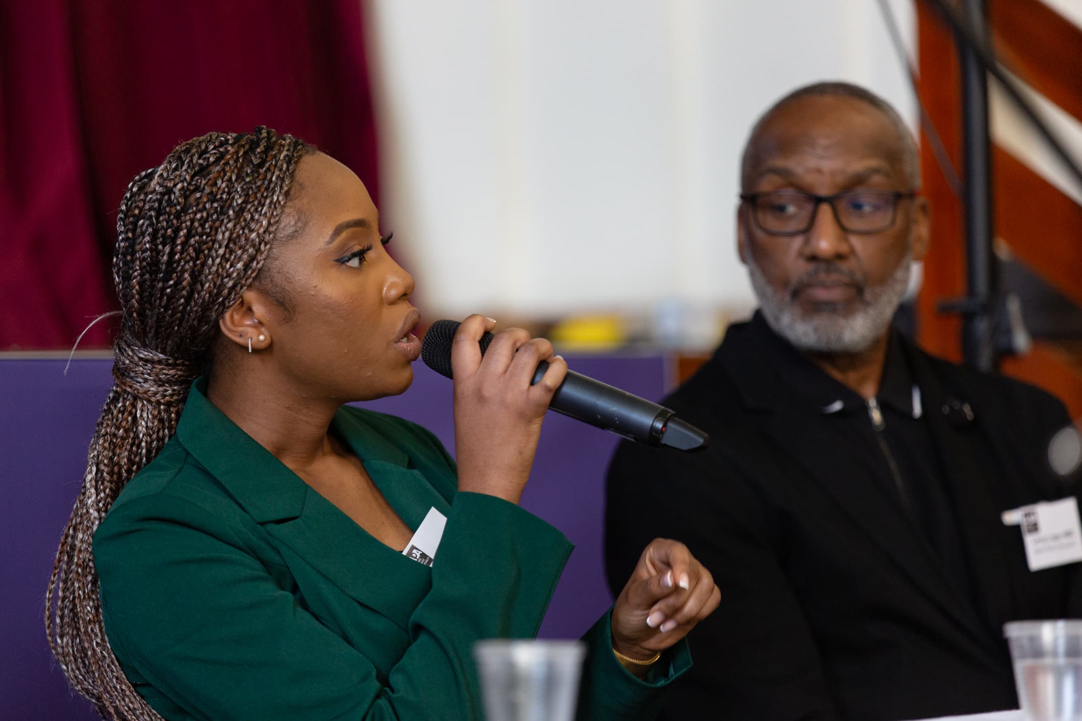 April Lamai and Leroy Logan speaking on a panel at APA's founding conference